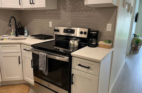 Queens Apartment | A Gem in the Heart of Queens: 2 Bed + 2 Bath with Large Backyard