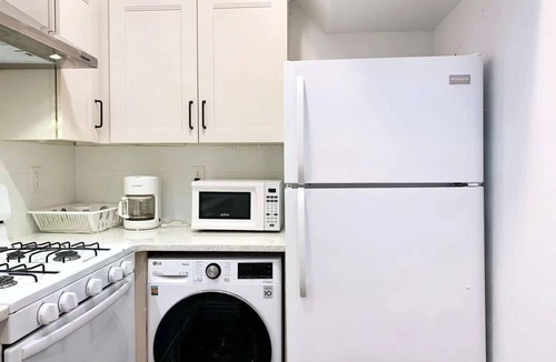 East Flushing House | Stylish 3-bedroom House with Skylight and Access to Rooftop Deck and Patio