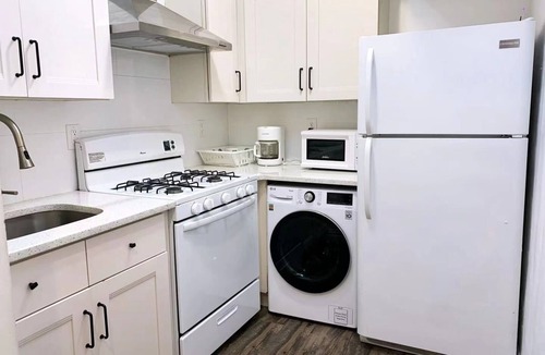 East Flushing House | Stylish 3-bedroom House with Skylight and Access to Rooftop Deck and Patio