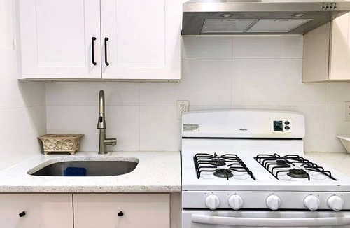 East Flushing House | Stylish 3-bedroom House with Skylight and Access to Rooftop Deck and Patio