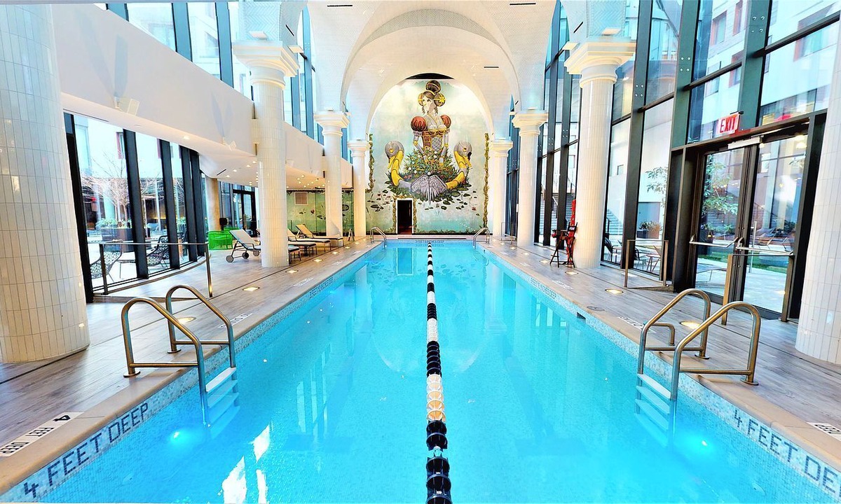 East Williamsburg Condo | Electrifying 1-bedroom condo with Bowling, Pool, Theater and Rock Climbing!