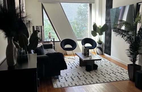East Williamsburg Condo | Electrifying 1-bedroom condo with Bowling, Pool, Theater and Rock Climbing!