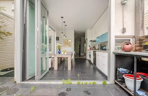 Kensington House | Spacious, artful 4-bedroom house in Brooklyn with lush backyard, parking, A/C