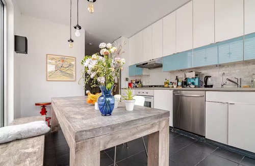 Kensington House | Spacious, artful 4-bedroom house in Brooklyn with lush backyard, parking, A/C